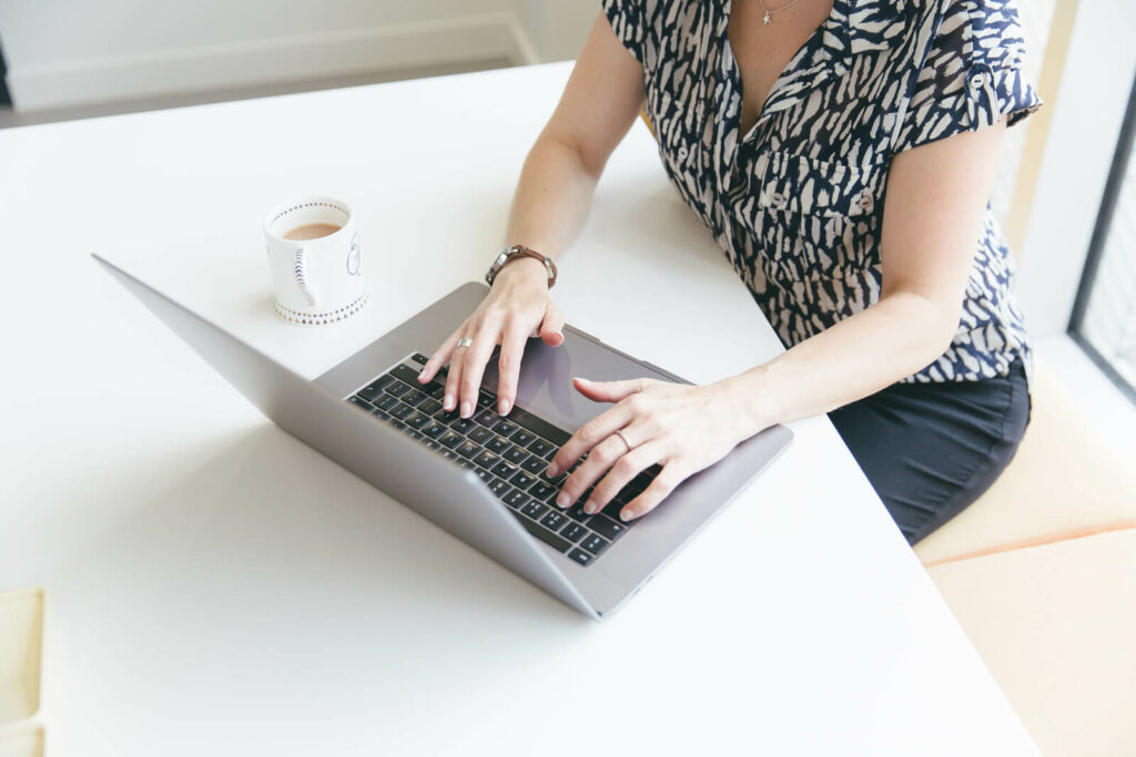 Hazel Whicher writing an email newsletter to help business owners with ServiceM8